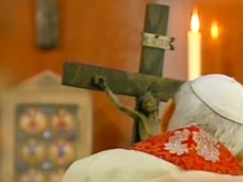 Pope John Paul II holds a crucifix carved by Stanisław Trafalski on Good Friday 2005